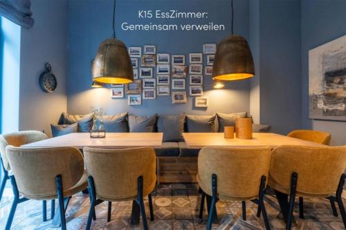 a dining room with a table and chairs at Logierhaus K15 Appartement 6 in Borkum