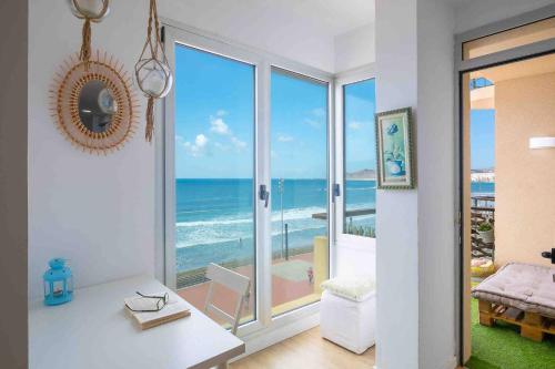 a living room with a view of the ocean at Numancia 1-4B in Las Palmas de Gran Canaria