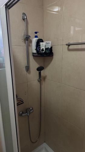 a shower in a bathroom with a shower at The Travellers Den in Matosinhos