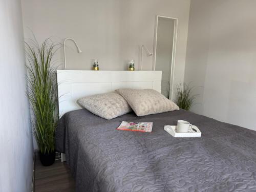 a bedroom with a bed with a tray on it at Appartement Briesenick-Radde in Tossens