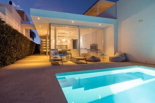a swimming pool in the backyard of a house at Villa D'Argento in Ragusa