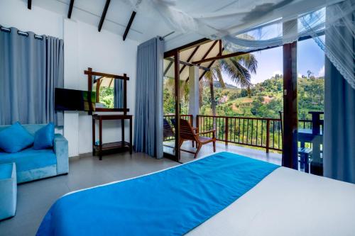 a bedroom with a bed and a balcony at Ella Blue Heaven in Ella
