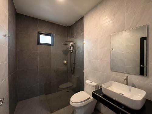 a bathroom with a toilet and a sink and a shower at Soul House - Stay Beautifully in Ko Kong Nui