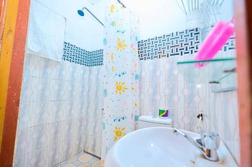 a bathroom with a sink and a shower and a toilet at A & J Services in Tesa