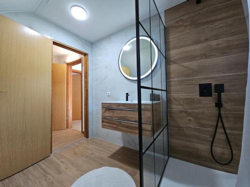 a bathroom with a sink and a mirror at Villa Aylin in Bihać