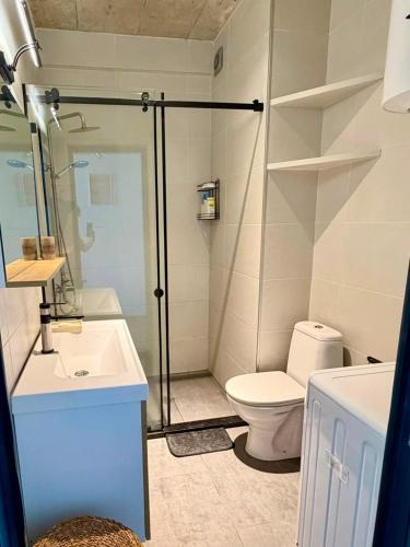 a bathroom with a shower and a toilet and a sink at Sunrise Panorama Terrace in Ozurgetʼi