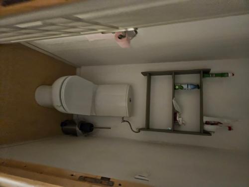 a bathroom with a mirror and a hair dryer at comfortable village house in Le Fossat