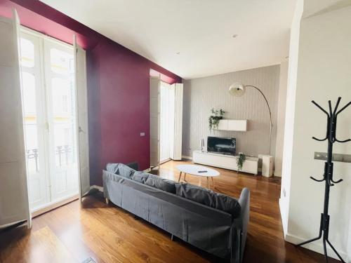 a living room with a couch and a table at M-Room in Málaga