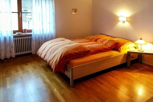 a bedroom with a large bed in a room at NEU! FeWo Moritz OG in Selters