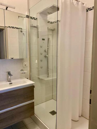 a bathroom with a shower and a sink at Montebello in Bellinzona