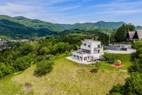 an aerial view of a white house on a hill at Luxury Villa with Indoor Pool and Sauna in Zagreb