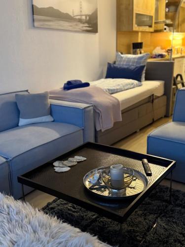 a living room with a couch and a coffee table at BeachPark Sierksdorf in Scharbeutz