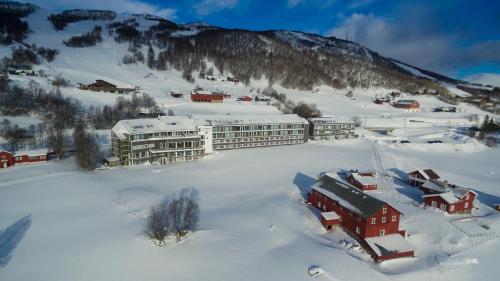 an aerial view of a resort in the snow at Ustedalen Hotel Geilo in Geilo