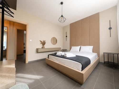 a bedroom with a large bed in a room at Olea Luxury Living in Nea Fokea