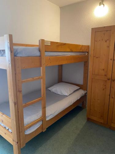 a couple of bunk beds in a room at VVF Jura Les Rousses in Prémanon