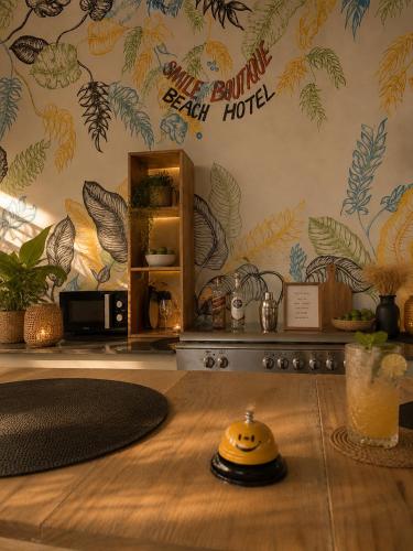 a room with a table with a yellow helmet on it at Smile Boutique Beach hotel in Nungwi