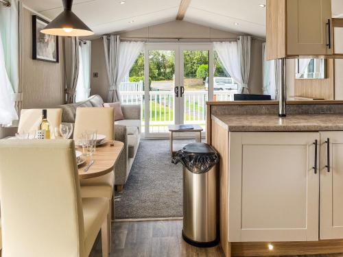 a kitchen and living room in a caravan at Drover's Den - Uk50090 in Durham