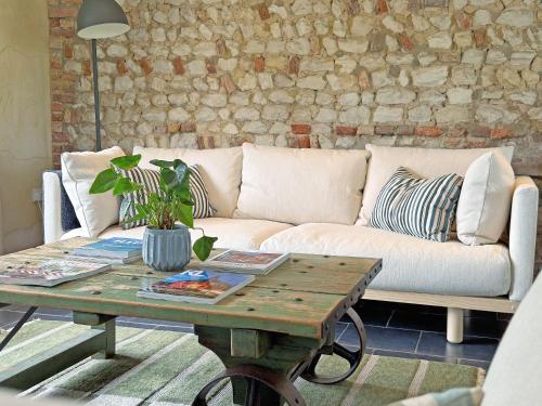 a living room with a couch and a coffee table at The Granary in Oxborough