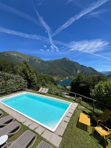 a swimming pool with a view of a mountain at Casa Europa in Ledro