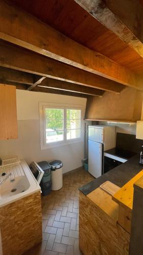 a kitchen with a sink and a counter top at Chalet Rec Fred in Matemale
