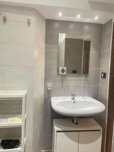 a bathroom with a sink and a mirror at Casa vacanze Da Fra in Cariati
