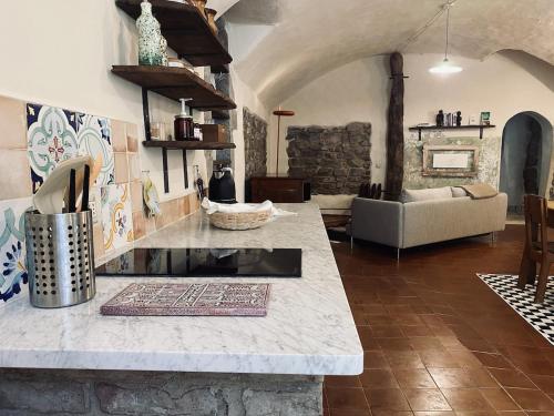 a living room with a table and a couch at Loft nel borgo di Tavernelle in Tavernelle