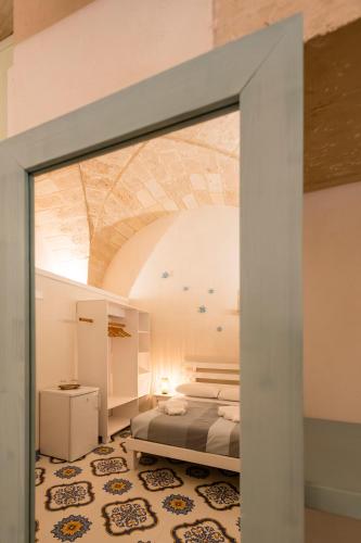 a bedroom with a bed in a room at Tenuta Monsalvato in Otranto