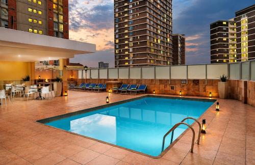 a swimming pool on the roof of a building at Oceanic Apartment - City and Stadium Views3 - Self-Catering in Durban