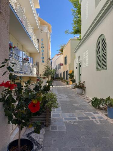 an empty alley with a plant and buildings at Florida Hotel & Apartments - Adults Only in Rhodes Town