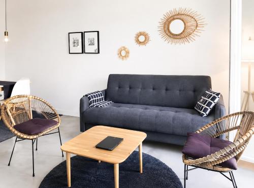 a living room with a couch and two chairs and a table at Cannes - Modern balcony flat perfect location in Cannes