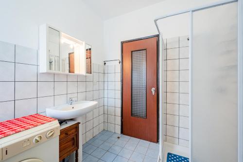 a bathroom with a sink and a toilet and a shower at All'antico Peso in Demonte