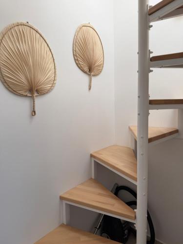 a room with wooden shelves and two mirrors on the wall at Kalithea Palekastro in Palekastron