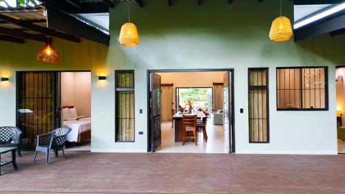 a room with a bed and a table and chairs at Villa Alma Verde in Fortuna