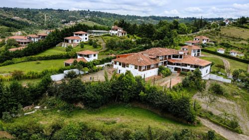 an aerial view of a village with houses at Hotel Puente Piedra in Villa de Leyva
