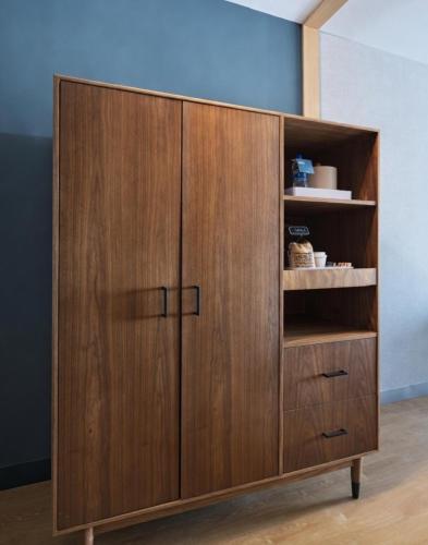 a wooden cabinet in a room with a wall at Four Points by Sheraton Fort Worth North in Fort Worth