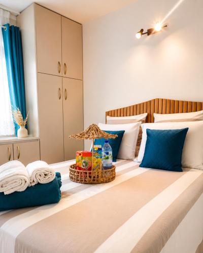 a bedroom with a bed with a basket of food on it at Le Cosy 888 Studio Plage 1 min Piscine Restaurants Casino in Les Trois-Îlets