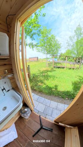 a view of a sink and a view of a field at Weinbergsauna in Großweingarten