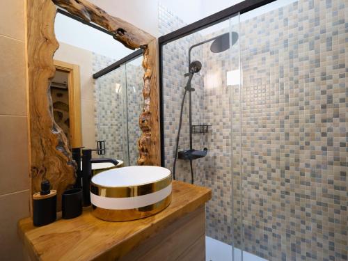 a bathroom with a sink and a shower at YourHouse A Casa Do Cordeiro in Allariz