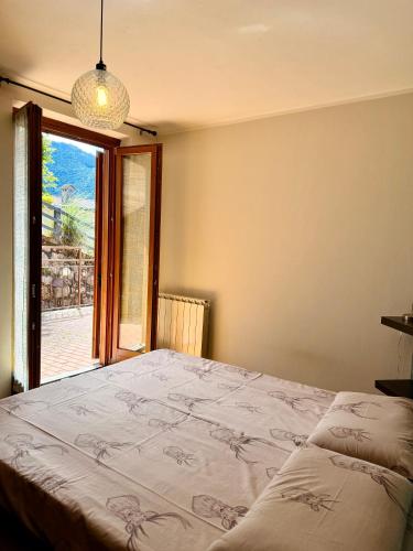 a bedroom with a large bed and a window at Pieve Antica in Piazza