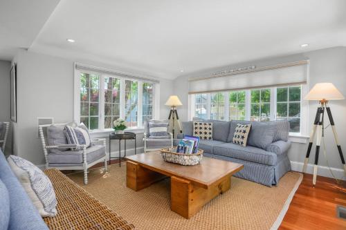 a living room with a couch and a coffee table at Sand Simeon - Relax, Unwind, Repeat in Chatham