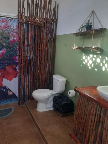 a bathroom with a toilet and a sink at Bayahibe Premium Pool in Bayahibe