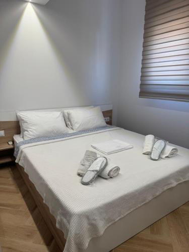 a bedroom with a bed with two phones on it at Sea & Luxury in Perea