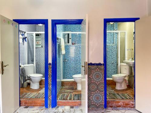 a bathroom with two toilets and a shower at Bluemoon house in Chefchaouen