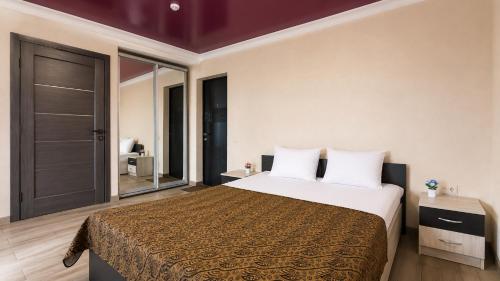 Ліжко або ліжка в номері Bloom Hotel