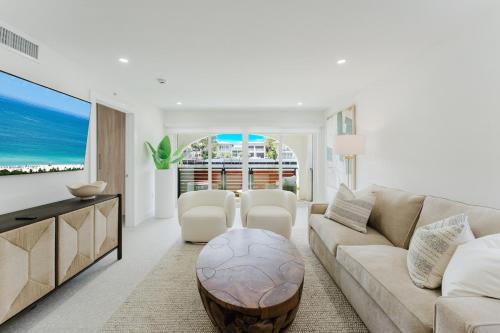 a living room with a couch and a table at The Mizner - 2BR Waterfront Boca Suite in Boca Raton