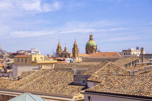 a view of roofs of buildings in a city at Solemar Sicilia - Torre Maqueda in Palermo