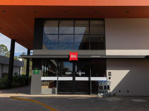 a building with a bus sign in front of it at ibis Araguaína in Araguaína