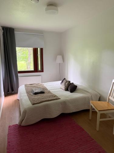 a bedroom with a large bed and a window at Opiskelijankatu 5 Varkaus in Varkaus