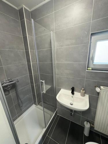 a bathroom with a shower and a sink at Home15 Kassel in Kassel