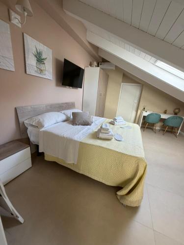 a bedroom with a bed and a table and chairs at Luxury Apartment Da Giovanni in Caserta